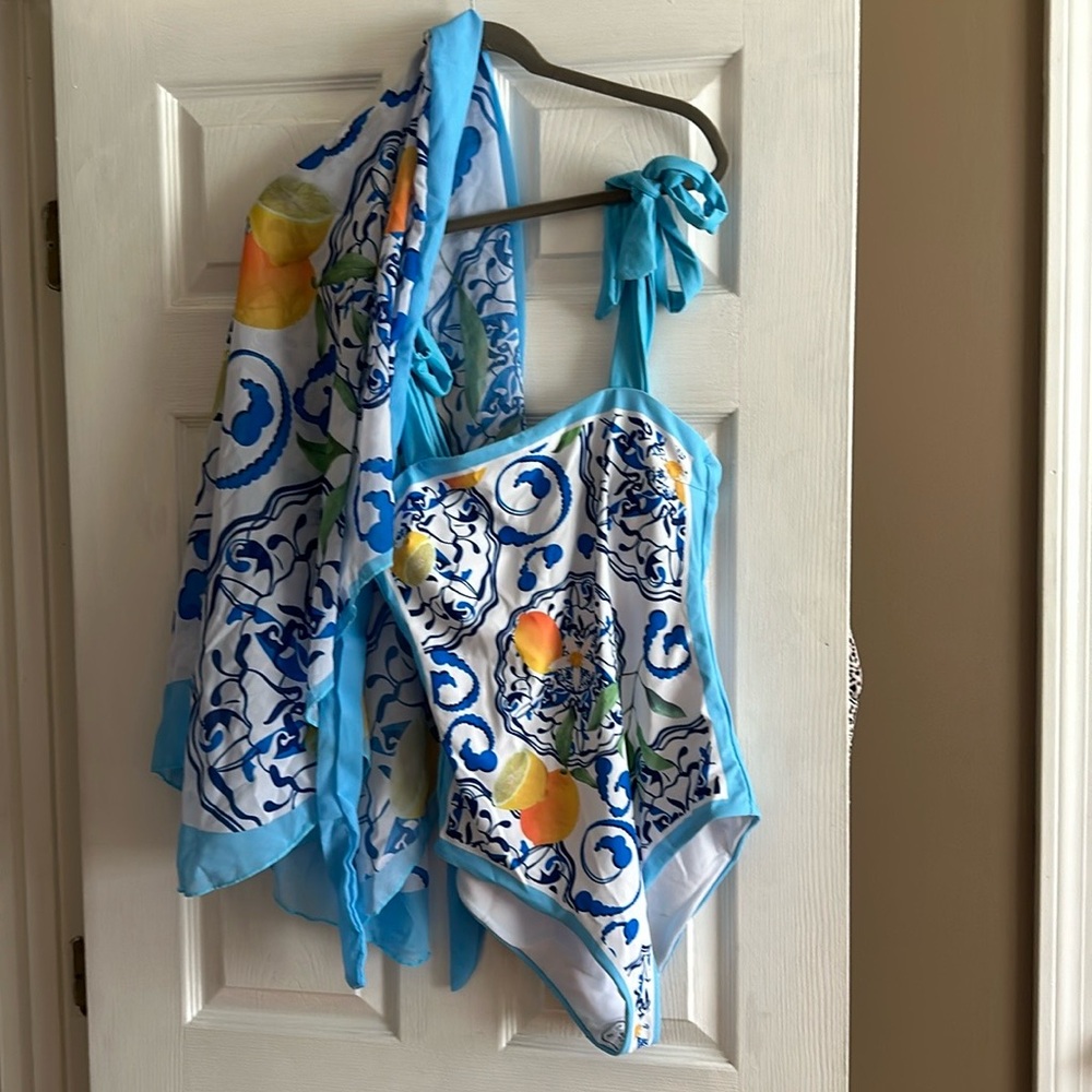 One piece swimsuit with matching sarong